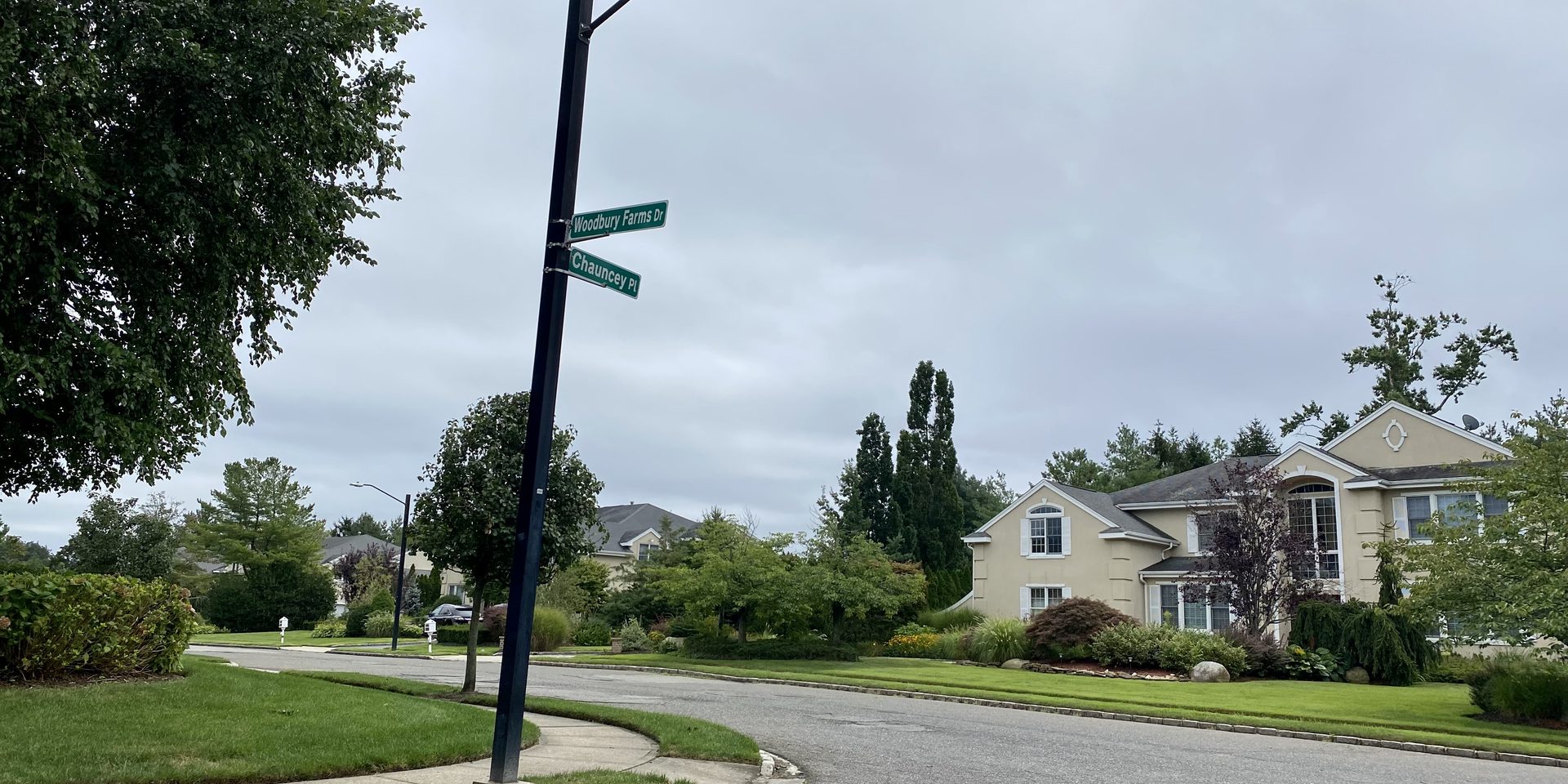 Intersection of Chancey Place and Woodbury Farms Drive in Woodbury, Long Island, New York, looking east-southeast on August 29, 2021